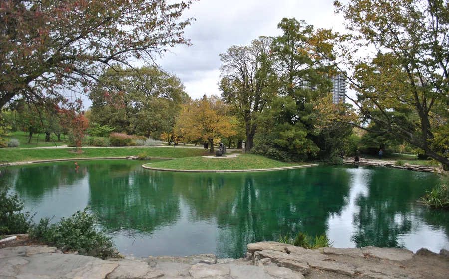 The spring-fed Twin Lakes at Eden Park, ringed by autumn trees