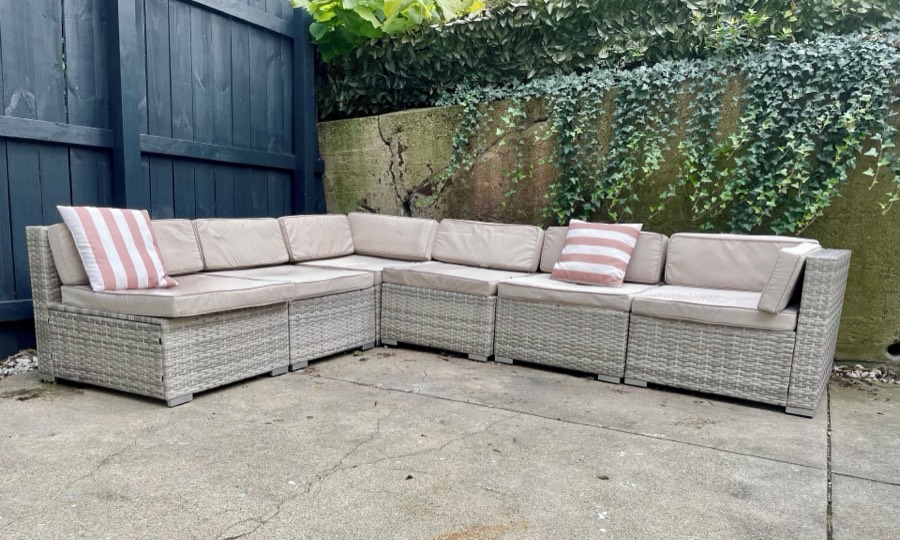 An outdoor sectional in the walled back courtyard.