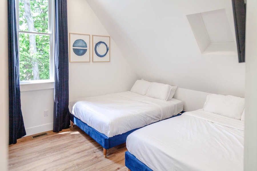 Unit 3, bedroom 1 — two queen beds, with its own bathroom