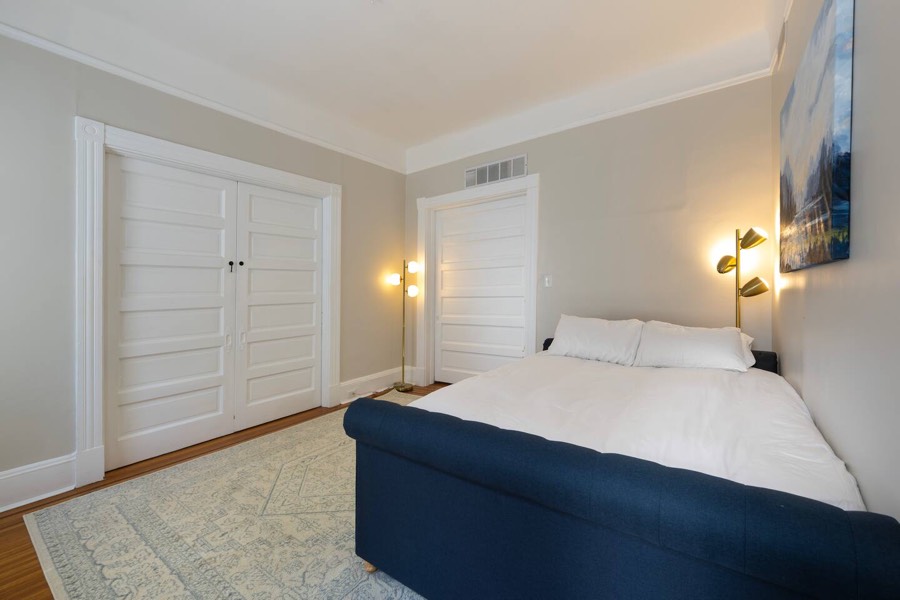 Off Unit 1's living room: a queen daybed with a full trundle. Pocket doors give you privacy, though they don't fully block the noise from the living room.