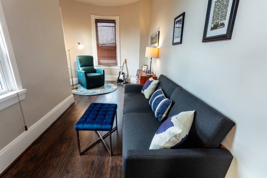 The second-floor turret is a reading area, and closes off with a curtain to use as another flex bedroom